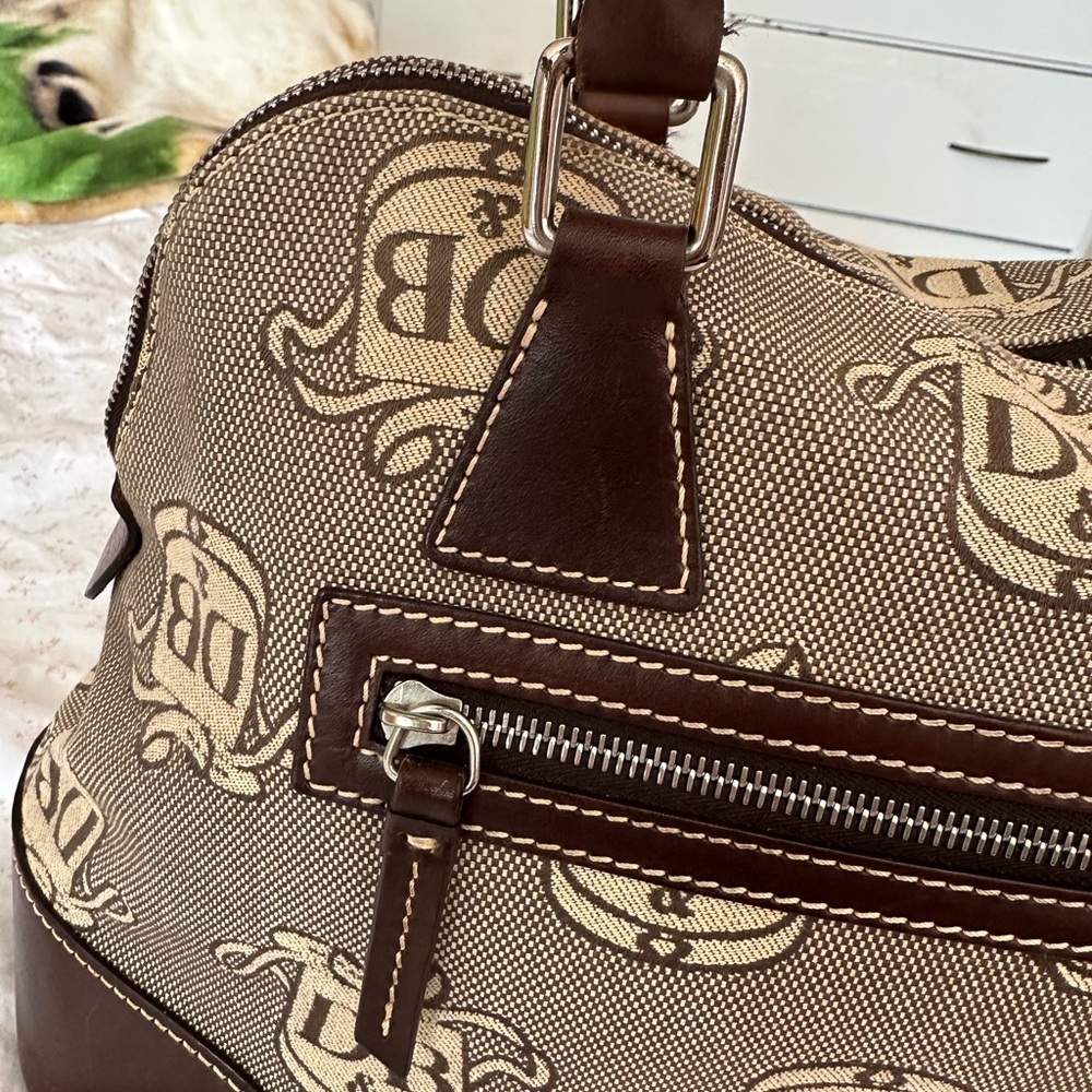 Beautiful Dooney & Bourke signature canvas and leather domed satchel.